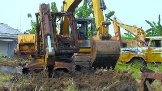 CAT 320D Moving An Old Abandoned Komatsu Excavator