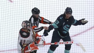 John Gibson holds stick the of Brandon Tanev