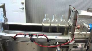 Pucks for Bottle Stability in a Distilling Line