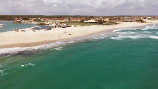 4K Cinematic Drone Footage: Soar Above the Crystal Clear Waters of the Beach on a Sunny Day