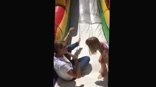 Going down the bouncy slide! Juneteenth Celebration