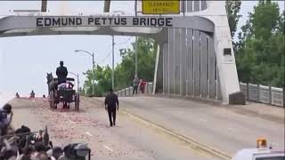 John Lewis Carried across EdMund Pettus Bridge where he last marched for voting rights in 1965