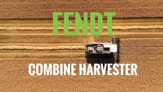 Fendt combine harvester cutting wheat in Lancashire. Drone view