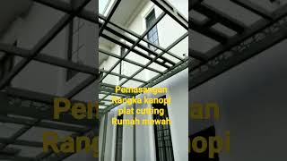 Pemasangan rangka kanopi plat cutting untuk rumah mewah