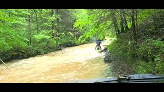 Dual Sport rider in flash flood