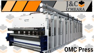 OMC Throughfeed heated Press 3m x 10.5m. Demonstration of machining process