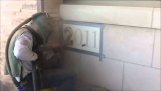 Sandblasting by Freedom Blasting in Indiana.  Limestone building signage blasting.