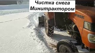 Как минитрактор выручает в чистке снега зимой