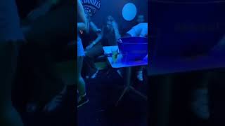 Man dives into woman at a bar and sits down like nothing happened