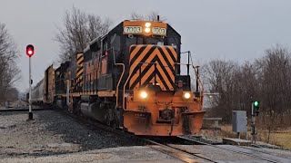 W&LE #7003 leads Rio Grande Tunnel Motor #5413 & 77 cars west through the Spencer Ohio junction.