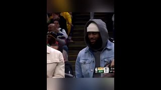 Lebron James on the bench clipping his fingernails during Lakers vs Celtics