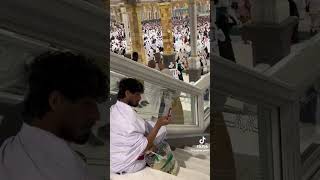 A person is taking Picture in makkah./A has love with M