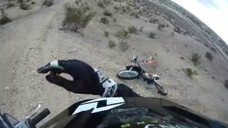 Dad falls off dirt bike and rolls down hill