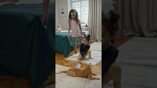 Watch as Two Cute Little Girls Play and Cuddle with their New Furry Friend!