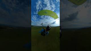 Person is taking off in a paraglider!