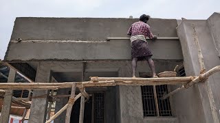 Plastering with cement mixture on the front brick wall of the house_ Construction of wall plastering