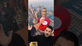 Sky-High Daredevil: Fearless Stunt Atop Dubai's Tallest Building!