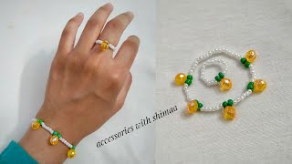 Orange fruit beaded bracelet with rings|اكسسوارات خواتم واساور بالخرز بشكل فاكهه البرتقال(اساور خرز)