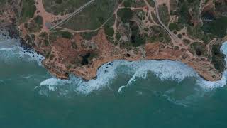 Aerial birds eye overhead top down of lagos cliff coast on windy day, portugal FREE STOCK VIDEO