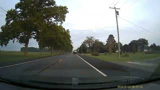 Funny tow truck driving with car door wide open