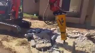 Indeco HP200 Rock Breaker demolishing concrete driveway