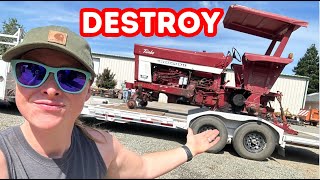 DESTROYING an old and beautiful tractor!