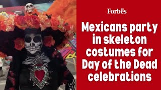 Mexicans party in skeleton costumes for Day of the Dead celebrations