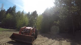 Kubota MX5100 digging holes with the BH90 1/2