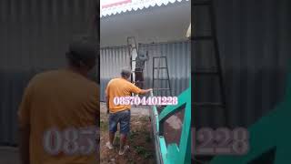 Proses pengecatan pintu Ruko harmonika berkwalitas