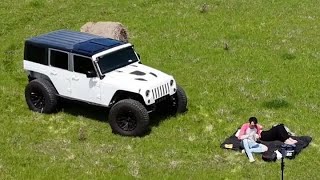 Comp Cut JKU on 40" tires w/ 2" lift DJI Air 3 fly by - non color graded