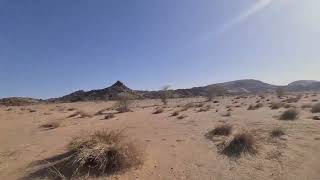 Traveling through a hilly area on the way out from Bîr Mogreïn, Tiris Zemmour Region, Mauritania.