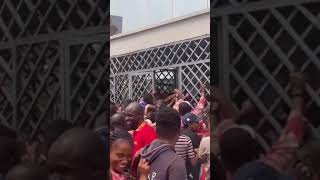 VIDEO: Customers climb gate to gain access into banking hall | Ideasgist