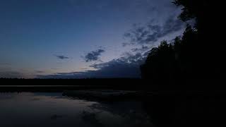 Tranquil lake dock time lapse as forest blue evening turns to night FREE STOCK VIDEO