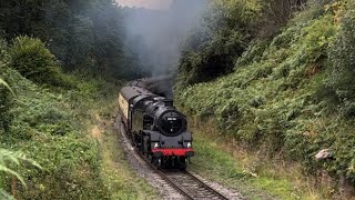 Great sight and sound as steam loco works hard up steep hill