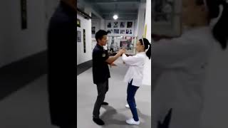 Wing Chun Master Yu Changhua coaching a girl