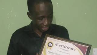 Busayo just received his certificate from our  Graphics design Training