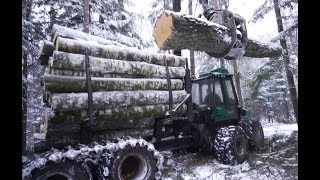 Logging in winter forest with Timberjack 1210