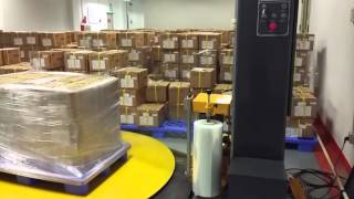 fully automatic pallet wrapping machine with put and cut film