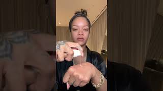 Rihanna applying one from her Fenty Beauty collection