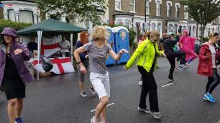 Tina Baker does aerobics in the rain.