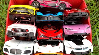 Box Full of Model Cars /Lamborghini URUS, Bugatti Bolide, BMW i8, Tesla Roadster, Apollo Project Ev