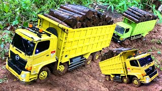 RC TRUCK HINO NEKAT TRABAS JALAN BERLUMPUR SAAT HUJAN DERAS BAWA MUATAN KAYU SAMPAI TERGULING