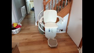 Curved Stairlift fitted to the inside of the staircase directly on the steps.