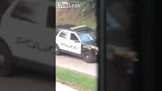 Police Officer Shooting Raccoon