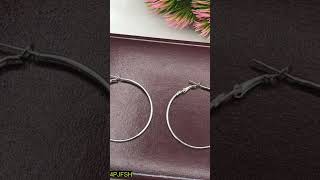 •  Material: Metal•  Round Hoops•  Silver Polish•  Size: Adjustable•  Pair Of Earings•