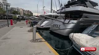 Boats, Cats, And The Aegean. Walking The Dog Seaside Piraeus.