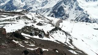 Alpine Ascent: Cable Cars Soaring Over Snow-Capped Peaks 🚡❄️