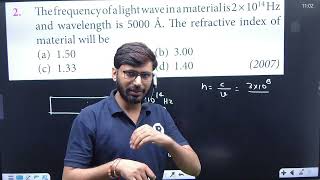 The frequency of a light wave in a material is 2 x 10 to the power 14 Hz and wavelength is 5000.....