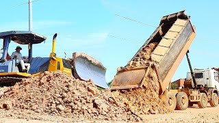 Nice operation of bulldozer to working with dump truck 25.5t