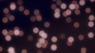 Purple Bokeh Circles on a dark Looped Background. Relaxing Screensaver. Free Version Footage.